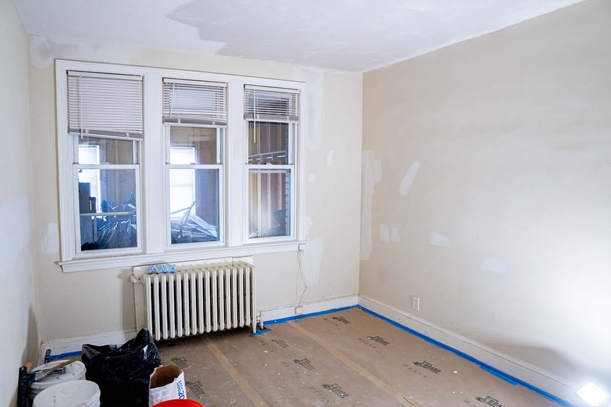 Apartment bedroom with plaster patches on the walls
