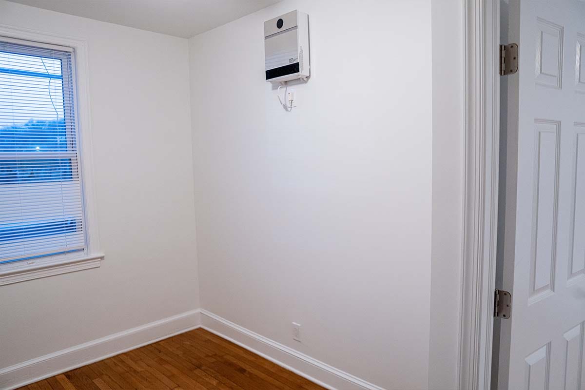 Drywall, finishing and painting complete inside an apartment bedroom located in Washington DC