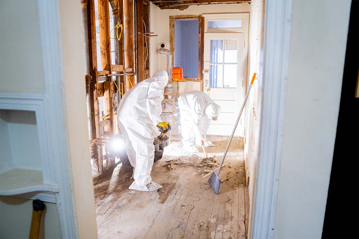 JVV Remodeling team cleaning demolition done inside an apartment kitchen located in Washington DC