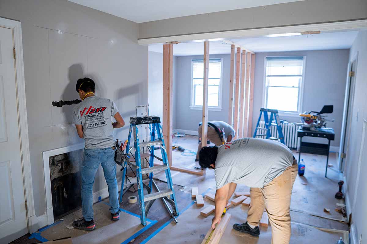 JVV Remodeling team renovating the living room of an apartment