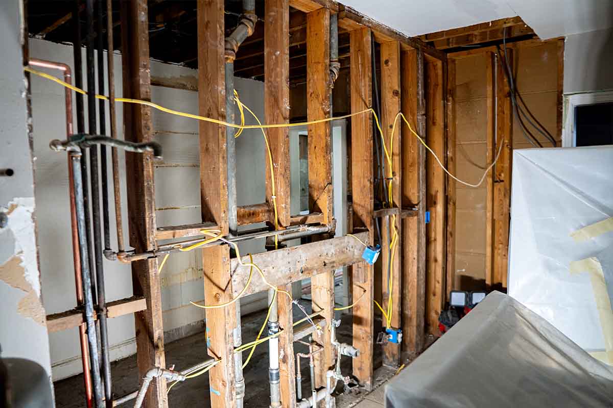 Kitchen with only framing built and electrical wires hanging