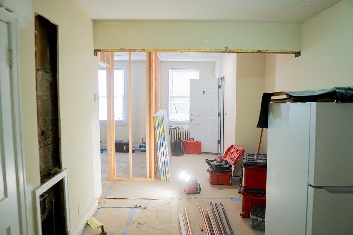 Wide view of a living room inside an apartment under construction