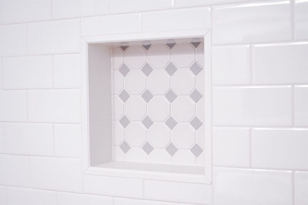 Closeup on ceramic shower niche installed in a Takoma DC tub and shower