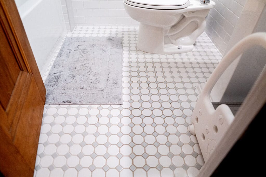 Closeup on new ceramic flooring installed in a Takoma DC hallway bathroom