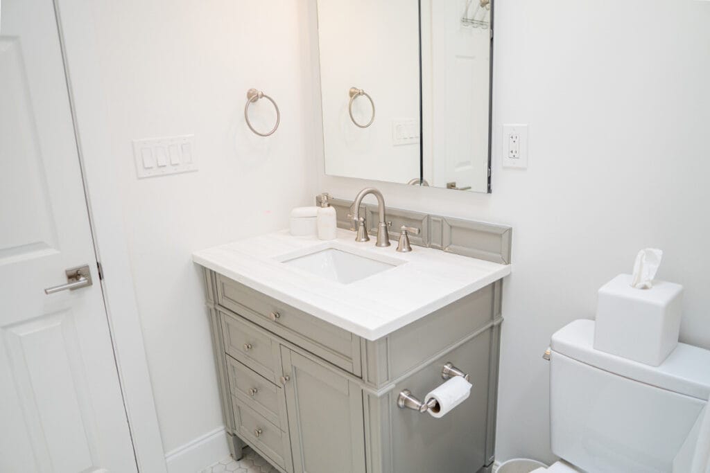 Closeup on new vanity installed in a DC hallway bathroom
