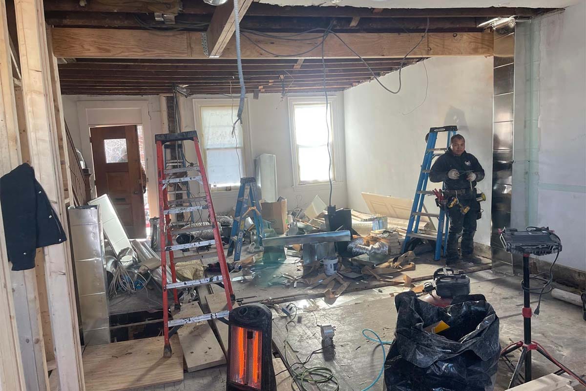 Kitchen and living room inside a DC rowhouse fully gutted