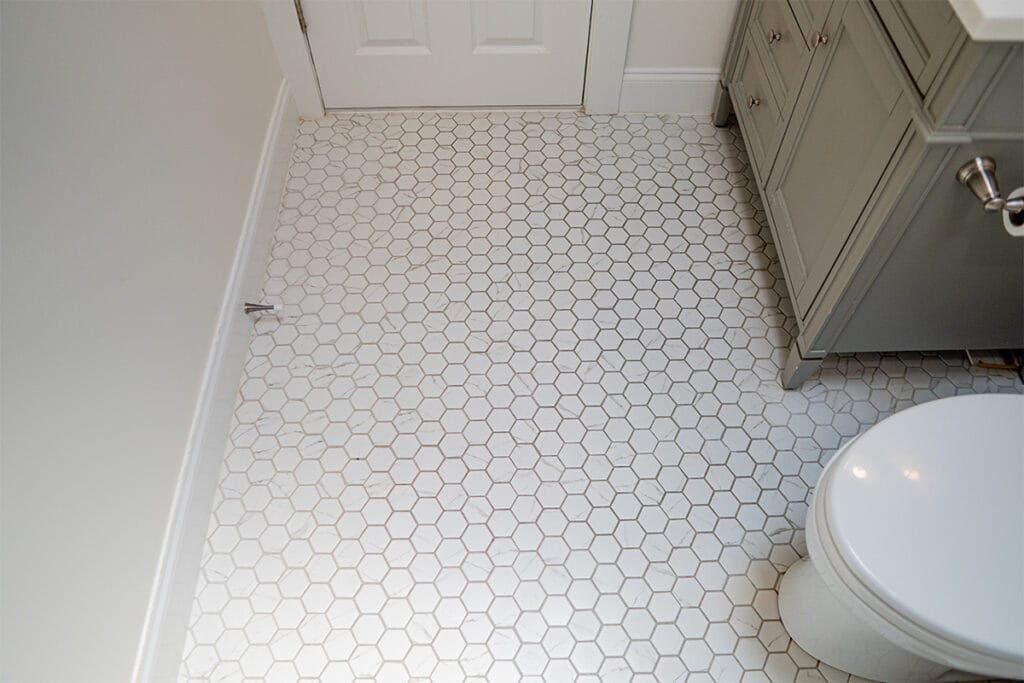New ceramic flooring installed inside a hallway bathroom in a DC hallway bathroom