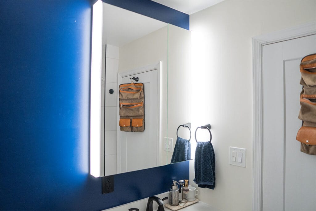 New mirror installed in the hallway bathroom of a Virginia home